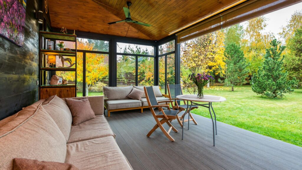 Terrace with comfortable couches and armchairs around table